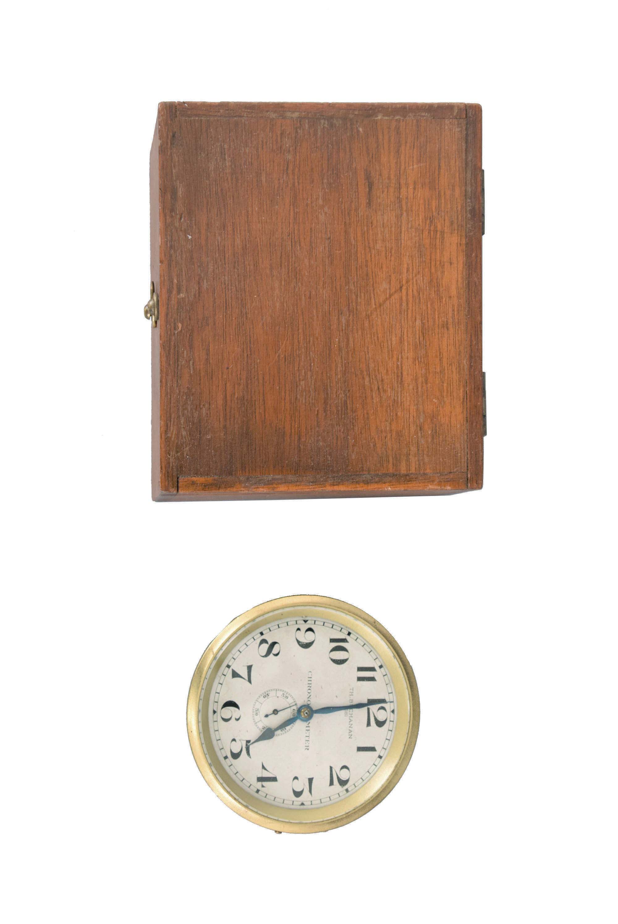 Two pocket chronometer movements, now in brass bowls for gimbal mounting, the first marked "Thos. Buchanan Dublin", 14 jewel fusee movement with Earnshaw spring detent escapement, Z balance with compensation limiting device and helical balance spring, silvered Arabic numeral dial, blued steel hands, serial #1581, the other marked "E. Perregaux", 20 jewel nickel bar movement with pivoted detent escapement, and cut bimetallic balance with gold timing screws, Arabic numeral silvered dial, blued steel hands, serial #7098 — Antique Clocks Price Guide