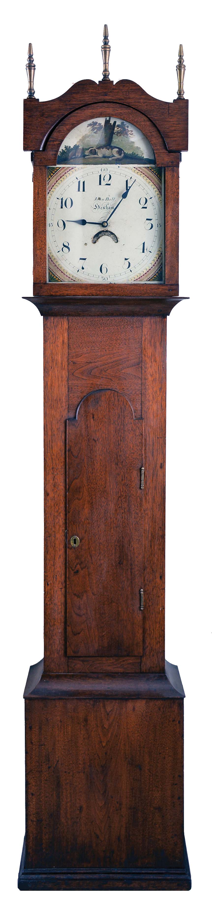 John Bell, Hexham, England, 30 hour, time and bell strike, single weight driven movement, c. 1830, in an American walnut case with three brass finials and painted metal dial — Antique Clocks Price Guide