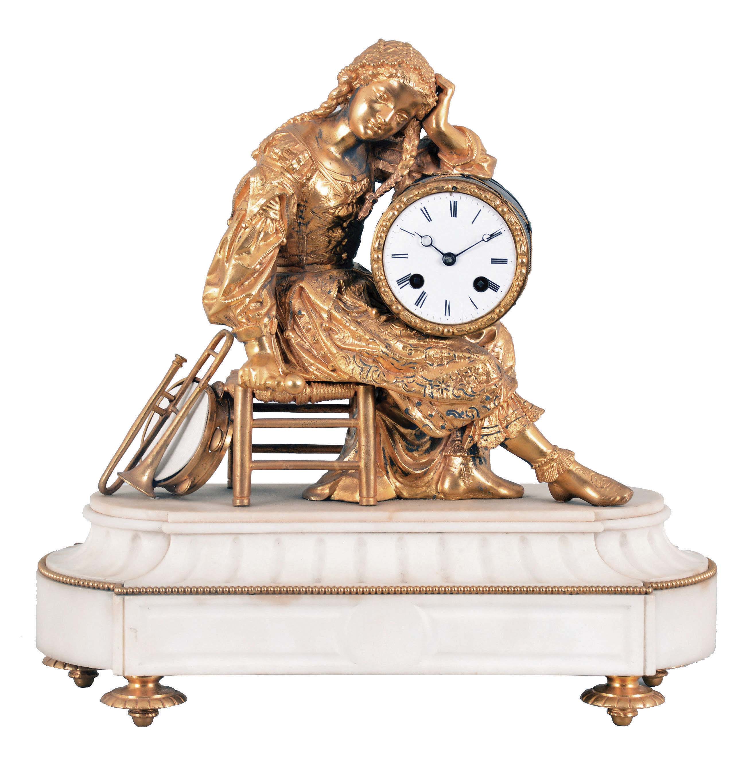 Musical Themed French Figural Clock with seated lady playing a drum, the gilt spelter figure seated on a rush-seated stool and arm folded leaning on her drum which carries a white porcelain roman numeral dial and moon hands at the front and a Japy Freres eight day, rack-striking movement cast with the Freres logo, powered by two coiled springs and regulated by pendulum, a trombone and tambourine leaning on the chair complete the setting, all on an alabaster fluted base with gilt beads and raised rosette feet. — Antique Clocks Price Guide