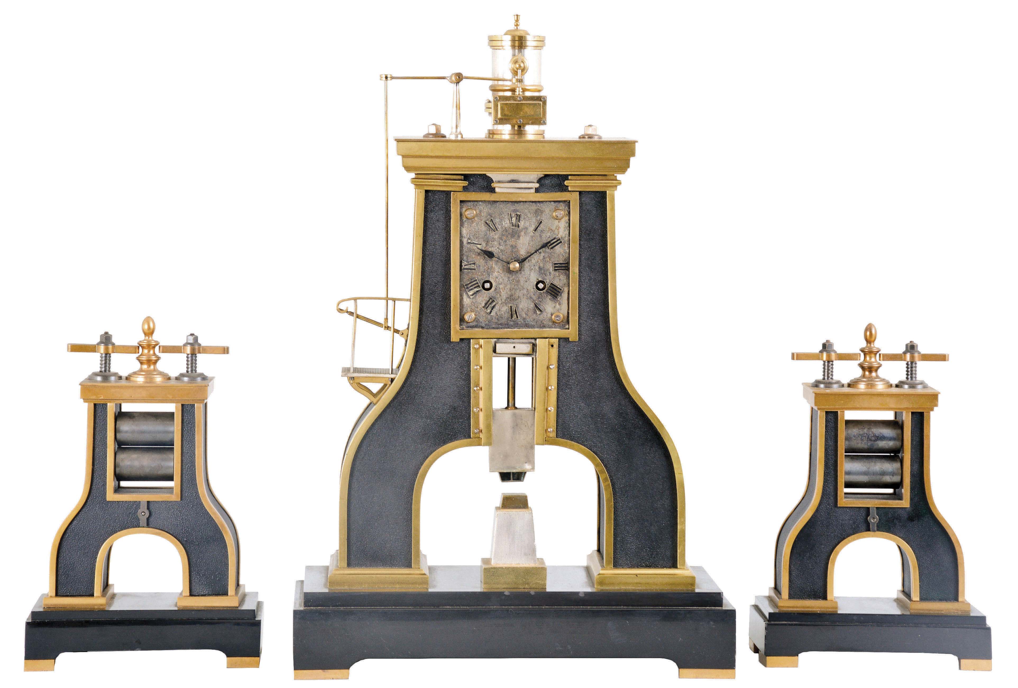 Guilmet, France, an impressive, industrial series Steam Hammer clock with side pieces, bronze case with gilt and patinated silver surfaces, on a footed, black slate base, the hammer forming part of the complex compound pendulum, rising and falling, appearing to strike the anvil as the clock runs, rectangular silvered dial with applied Roman numerals, blued steel hands, 8 day, time and strike pendule de Paris movement with Guilmets modifications, and also with Guilmet's mark on the back plate, together with matching, rolling mill side pieces, c1880 — Antique Clocks Price Guide