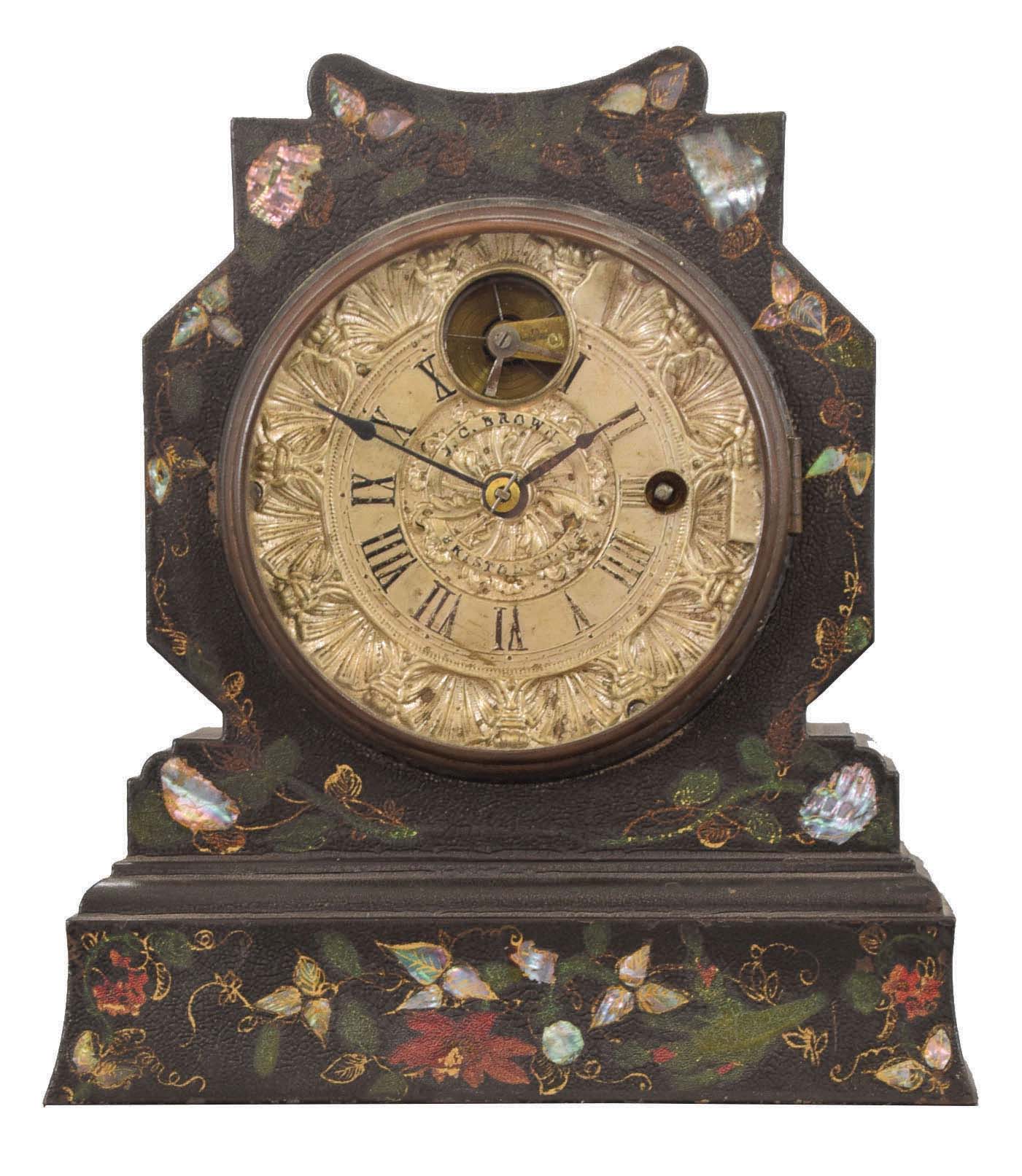 J. C. Brown, Bristol, Conn., shelf clock with a painted, gilt and MOP inlay decorated iron front case with a Noah pomeroy balance escapement movement with a fancy cast metal silvered dial, stamped with J. C. Brown signature. — Antique Clocks Price Guide