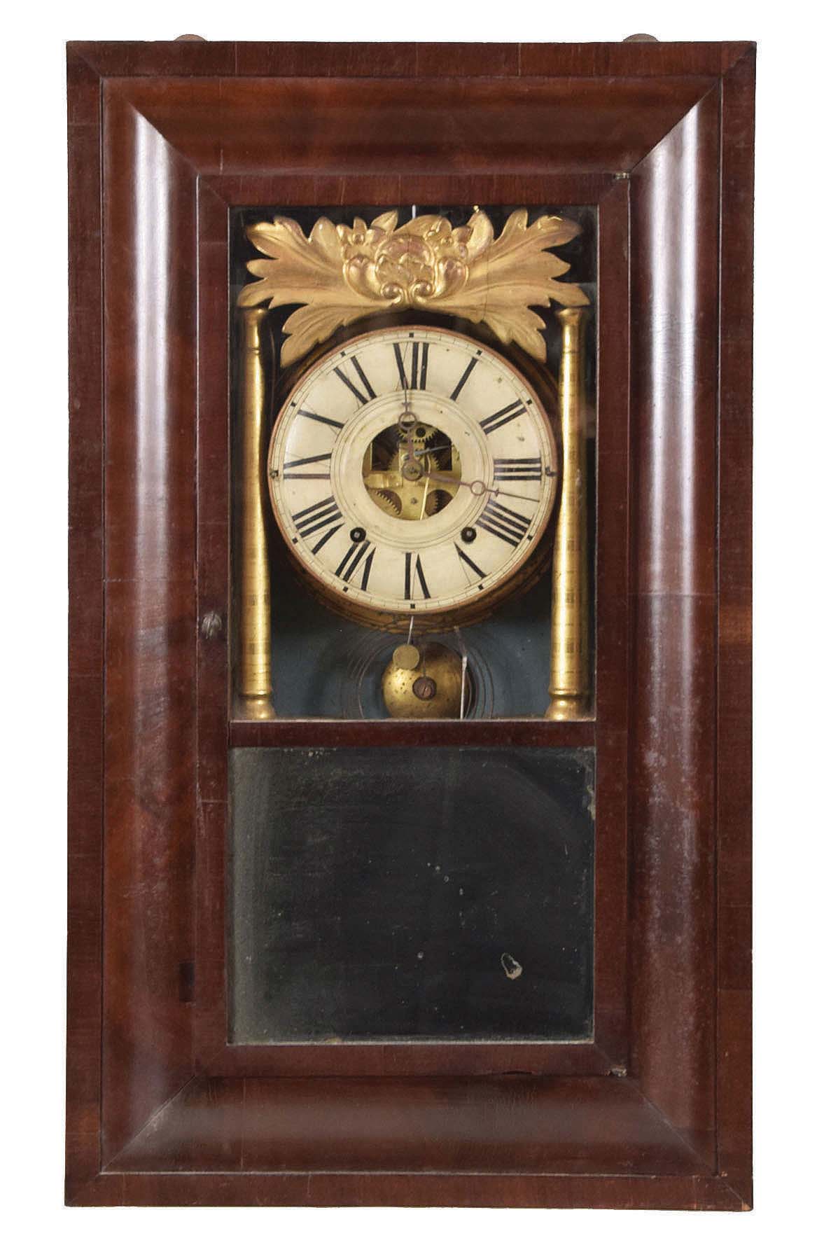 Joseph Ives, Plainville, Conn., 8 day, time and strike, weight brass movement O.G, gilt columns and gilt leaf crest shelf clock. This case has the earlier version of the movement as it has a partial cast iron backplate. The later version made by Hills, Goodrich &amp; Co had full cast iron backplate. — Antique Clocks Price Guide