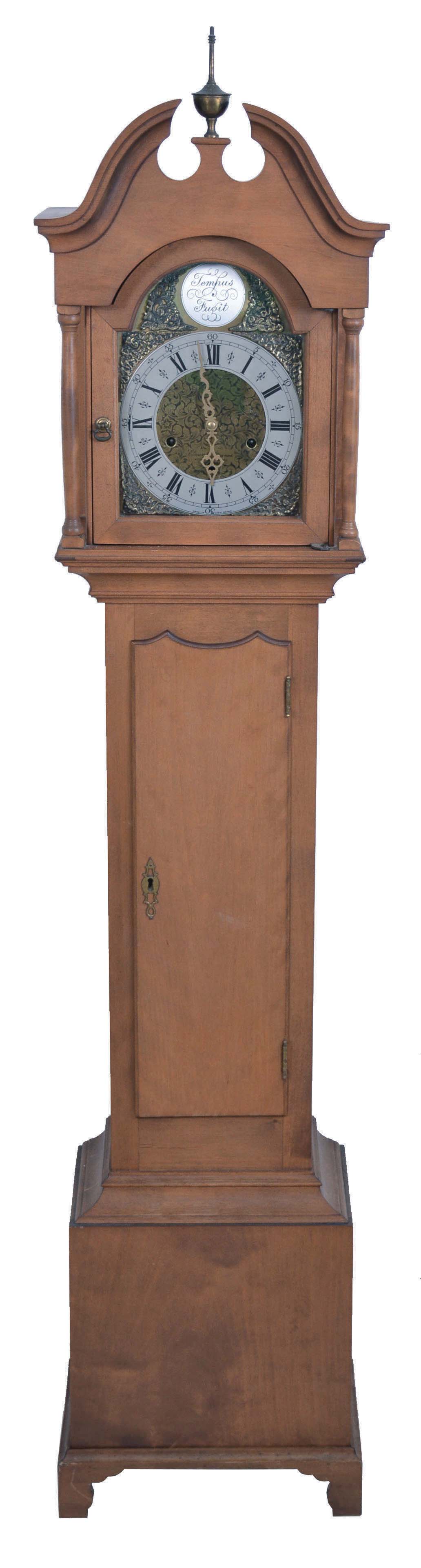 Elmer O. Stennes, Weymouth, Mass., dwarf tall or "Grandmother" clock, model "GM No. 2", 8 day, time, strike and Westminster chiming spring driven Smiths English brass movement with brass dial and silvered chapter ring in a cherry case, stamped "67" and "52" and branded with Stennes signature on rear of trunk door — Antique Clocks Price Guide