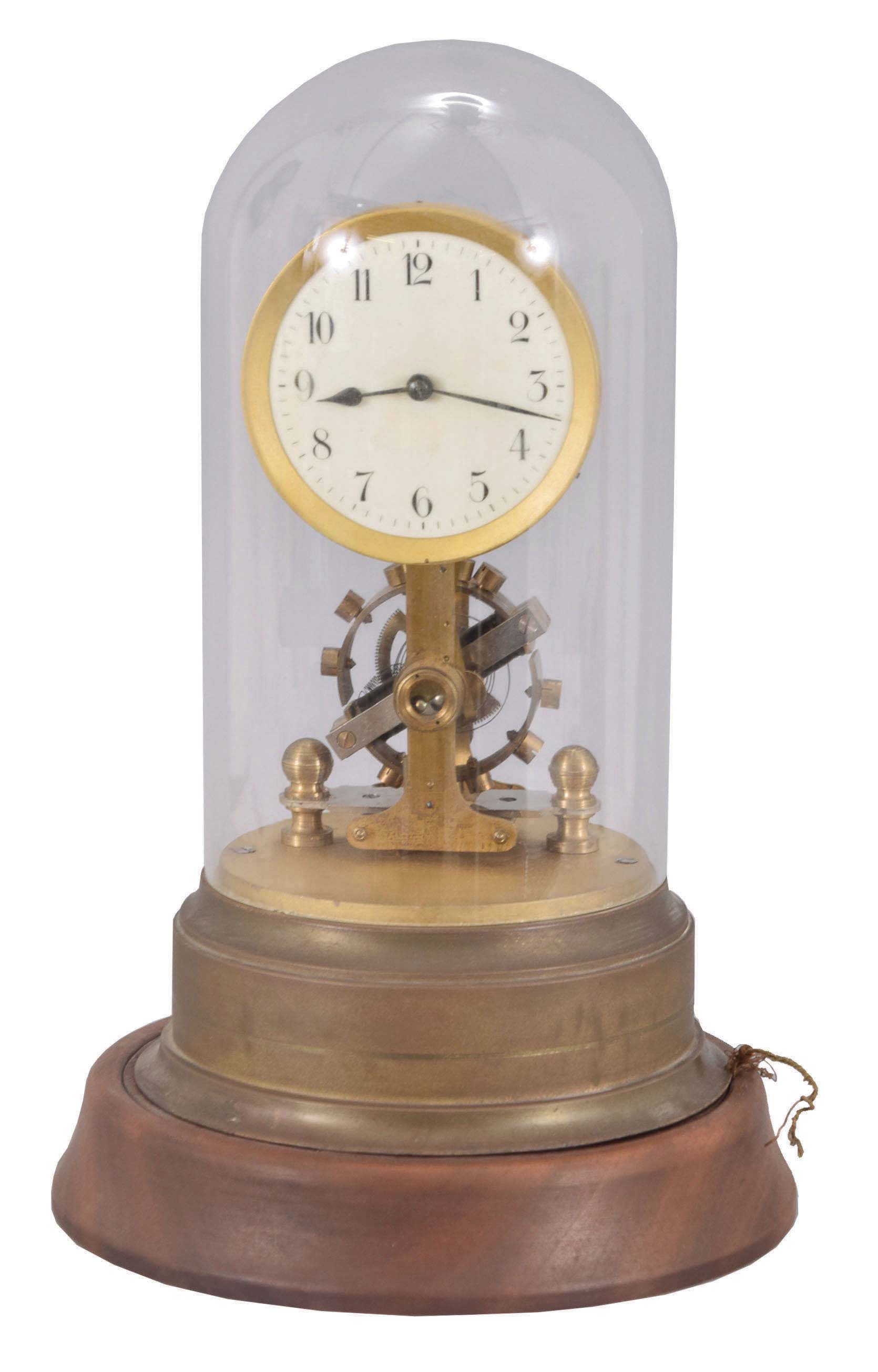 Germany, Eureka style, battery powered, electro-magnetic "skeleton" timepiece mounted on brass base with a large exposed rotating balance with dome. — Antique Clocks Price Guide