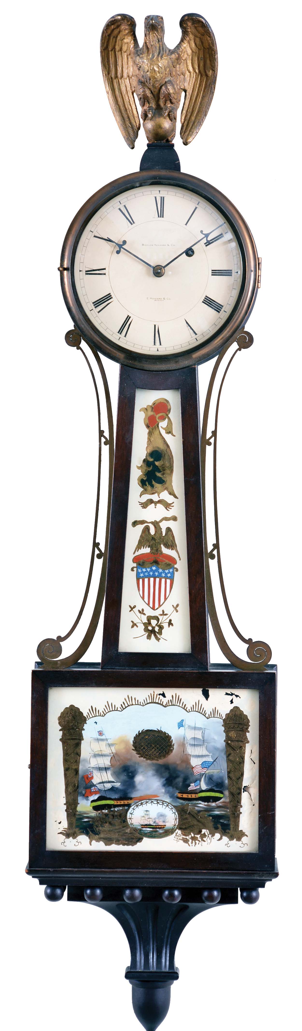 E. Howard &amp; Co., Boston, Mass., for Bigelow Kennard &amp; Co., Banjo Clock, with brass eagle finial surmounting the zinc roman numeral dial inscribed "E. Howard &amp; Co./Boston" and "Bigelow Kennard &amp; Co.", brass glazed bezel, flat frames housing the glasses, the lower glass depicting a British and American warship in battle during the War of 1812 both flying their national flags, cross-hatched oval for pendulum viewing, the waist glass flanked by brass side ornaments and showing a Federal shield and an American patriotic eagle, all resting on a carved pedestal, eight day nickel plate time only movement with front plate inscribed "E. Howard &amp; Co./Boston", maintaining power, Geneva stop (now gone), viewing port for the recoil escapement all powered by a lead weight and regulated by a flat wooden rod and brass faced pendulum bob, — Antique Clocks Price Guide