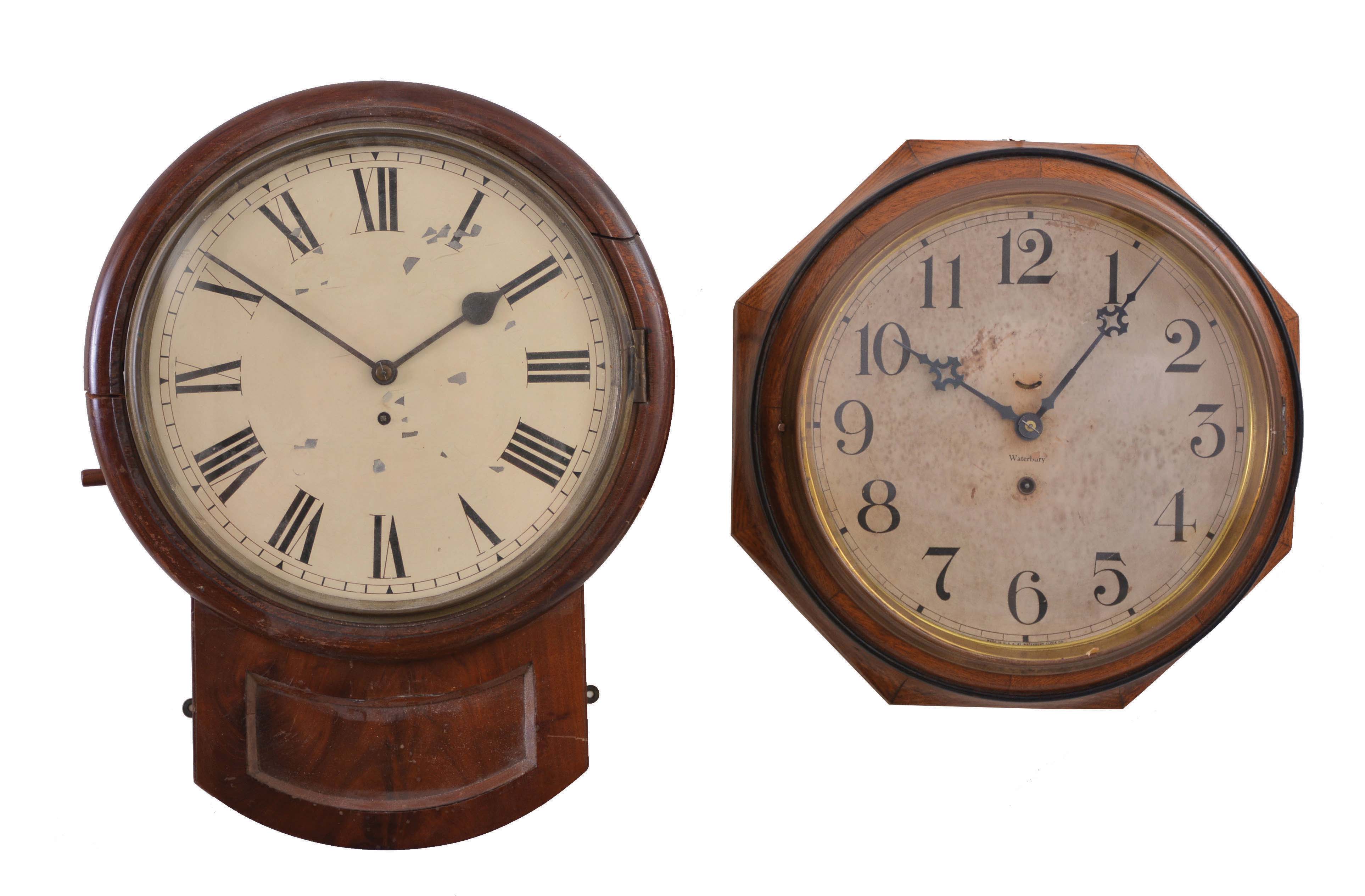 Clocks- 2 (Two) Hanging: (1) England, postal wall timepiece, 8 day, spring driven fusee movement in a walnut veneer case with painted metal dial; (2) Waterbury Clock Co., Waterbury, Conn., "Oak Lever" wall timepiece, 8 day, spring driven, balance wheel movement in an oak case with 12 inch dial. — Antique Clocks Price Guide