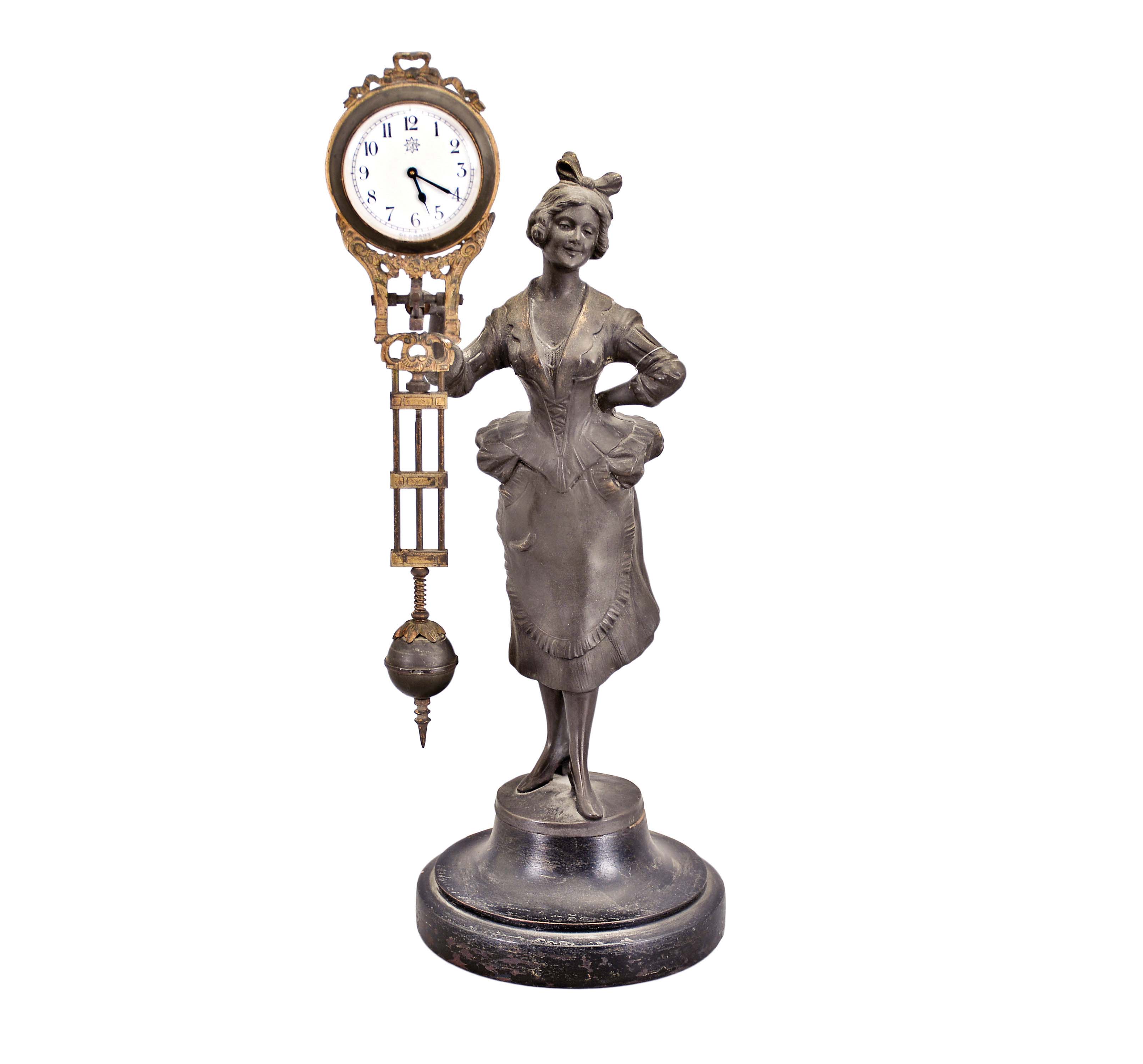 Germany, Junghans, maid figure, swinging arm novelty clock, spelter figured on a turned hard wood base, as-found — Antique Clocks Price Guide