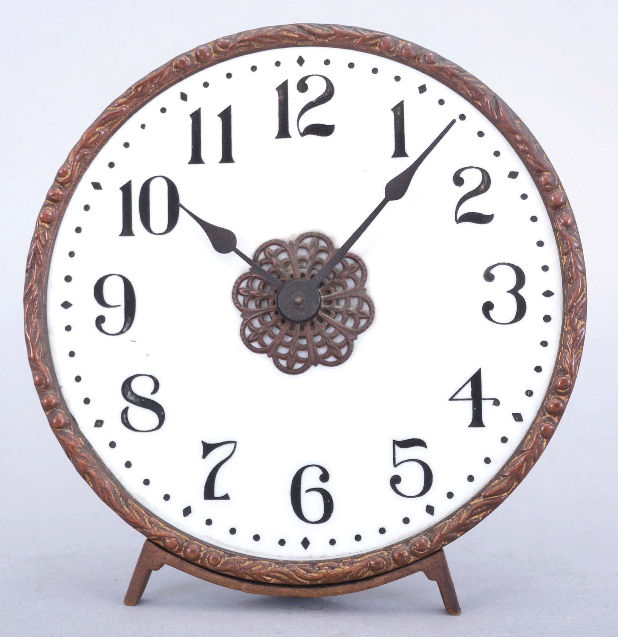 New Haven Clock Co., New Haven, Conn., "Gas Lamp" shelf clock, milk glass arabic numeral dial with small pin pallet, 1 day rear wind movement all on an easel frame. — Antique Clocks Price Guide