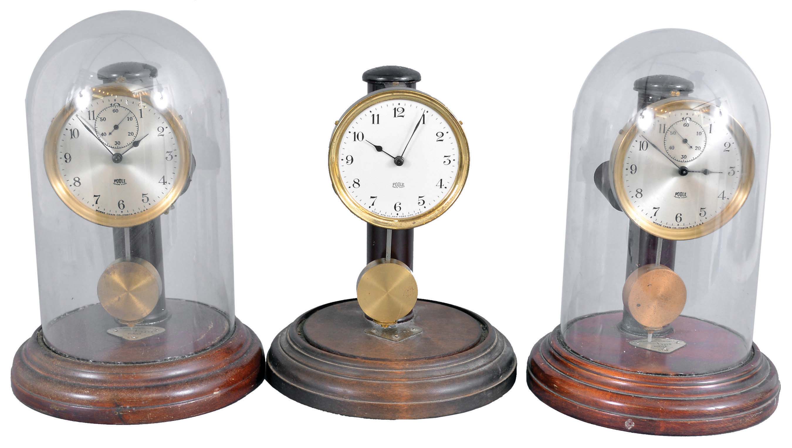 Clocks- 3 (Three) Poole: Poole Mfg. Co., Ithaca, NY, "Executive", electro-mechanical battery-driven mantel timepieces serial numbers1343, 2426, 3676. All with wood bases, two with silvered dials and one with white enamel dial. — Antique Clocks Price Guide