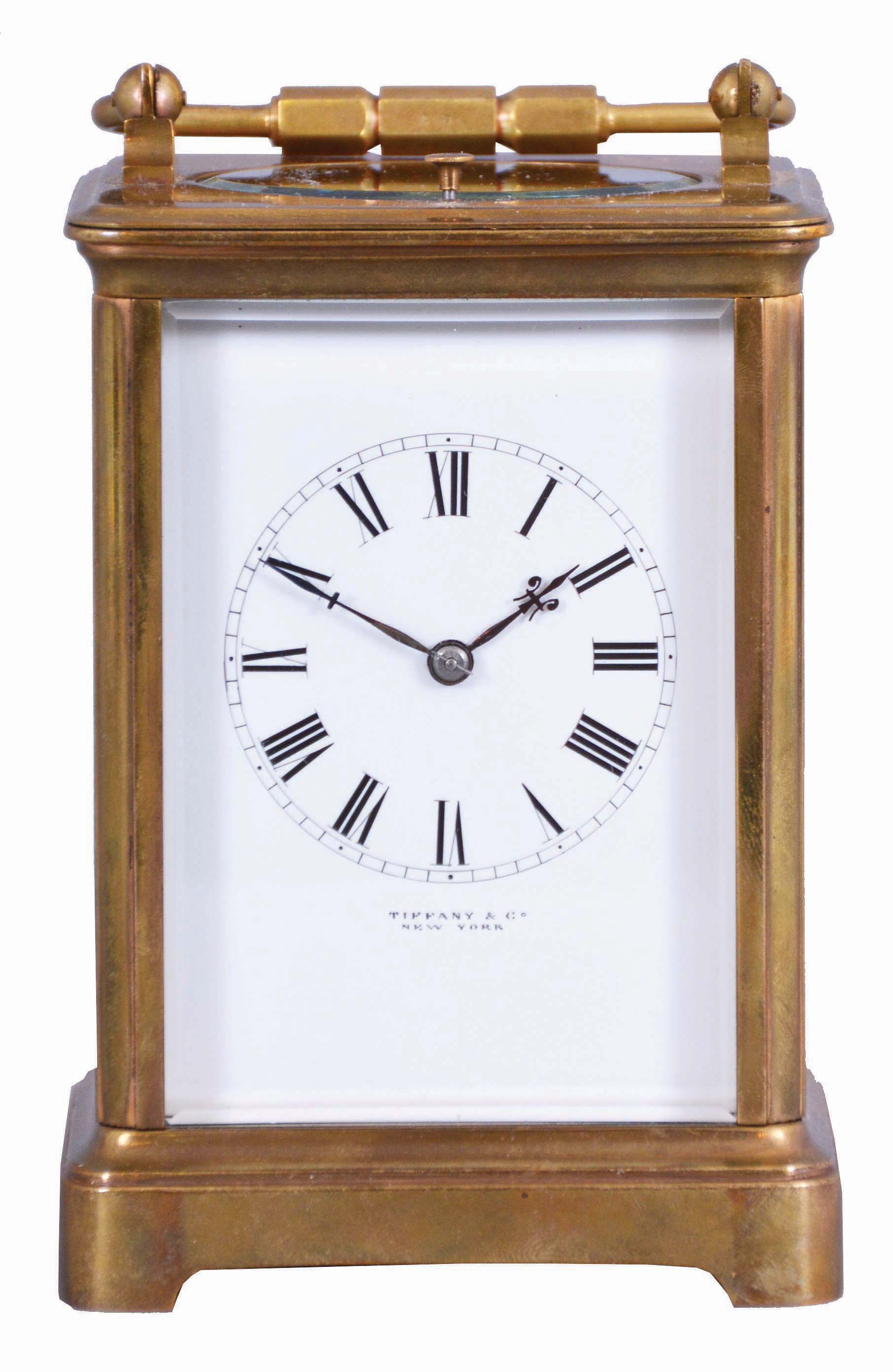 France, for Tiffany &amp; Co., New York, a rare five minute repeating carriage clock, glazed Corniche case, signed Roman numeral white enamel dial, blued steel hands, 8 day, time and strike movement with lever platform and cut bimetallic balance, counting the hours in passing, and repeating the last hour and five minute interval on demand, together with its leather covered wooden travel case — Antique Clocks Price Guide