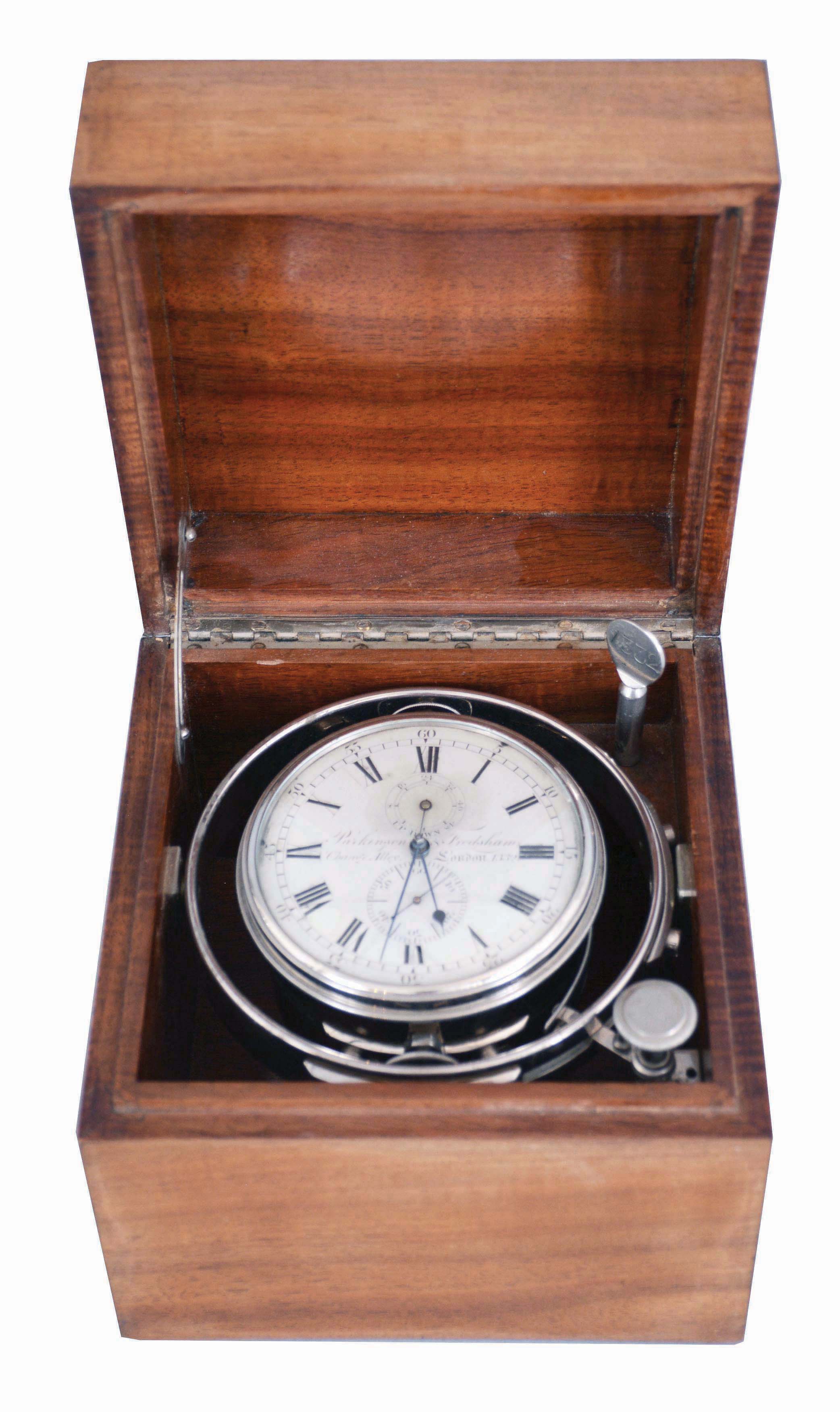 Parkinson &amp; Frodsham, Change Alley, London, an early 19th century two day marine chronometer with later box, 11 jewel, free sprung fusee movement with Earnshaw's spring detent, the cut bimetallic chronometer balance with blued, helical spring, and diamond endstone, Roman numeral silvered dial with wind indicator, blued steel spade and poker hands, contained in a shock mounted, nickel plated bowl, with nickel plated gimbals and original key, serial #1332, mounted in a later, purpose made, polished curly mahogany box — Antique Clocks Price Guide