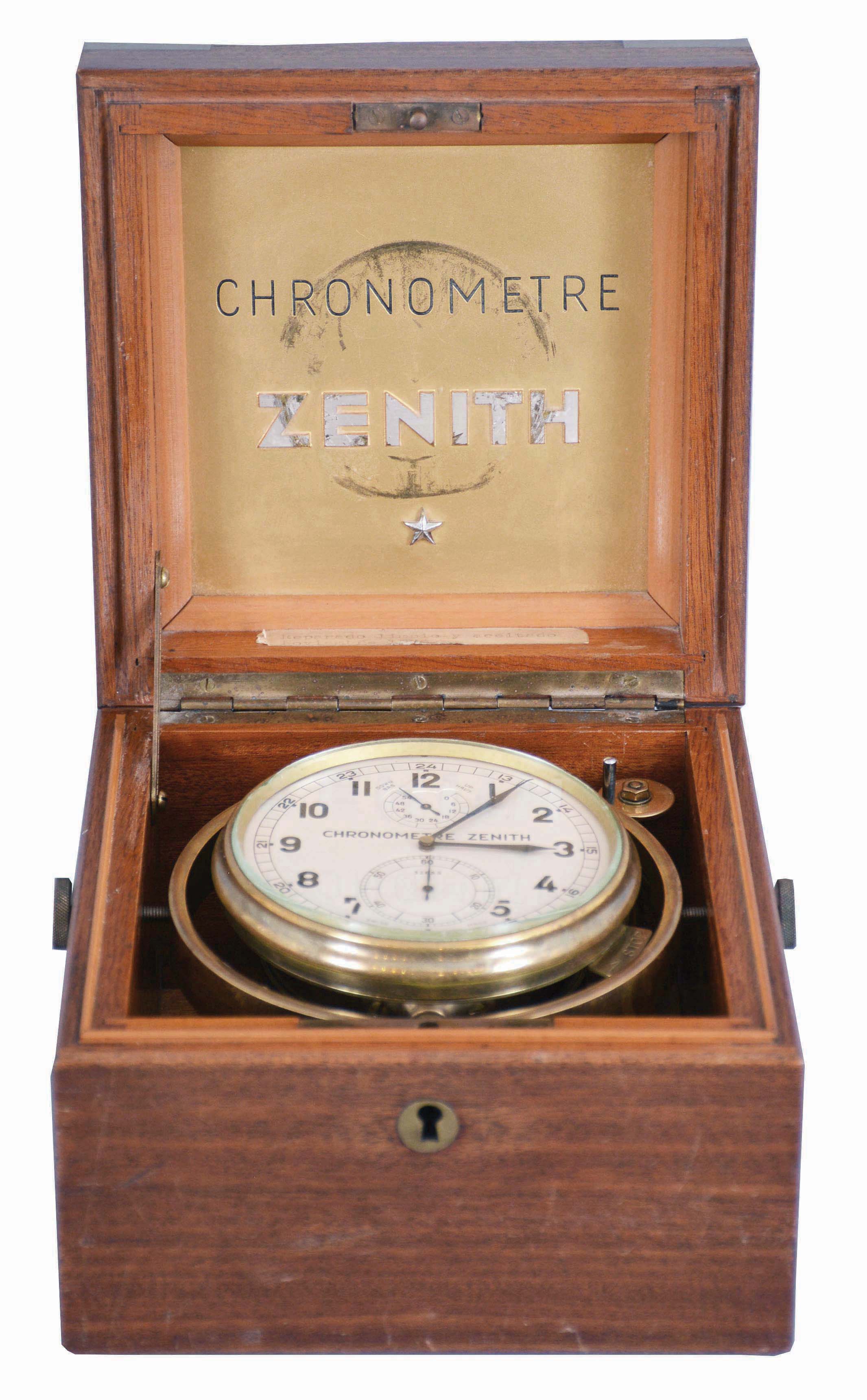Zenith, Switzerland, a two day, boxed, rim wind and set lever chronometer, the gilt, 19 jewel, 3/4 plate movement with large, monometallic balance, Breguet overcoil balance spring and micrometric adjustment for regulator pin spacing, Arabic numeral silvered dial marked "Chronometre Zenith", with constant seconds and wind indicator, blued steel hands, contained in a brass bowl with gimbals, the whole mounted in a locking mahogany box, the inside of the lid with brass Chronometre Zenith plaque, serial #32655 — Antique Clocks Price Guide