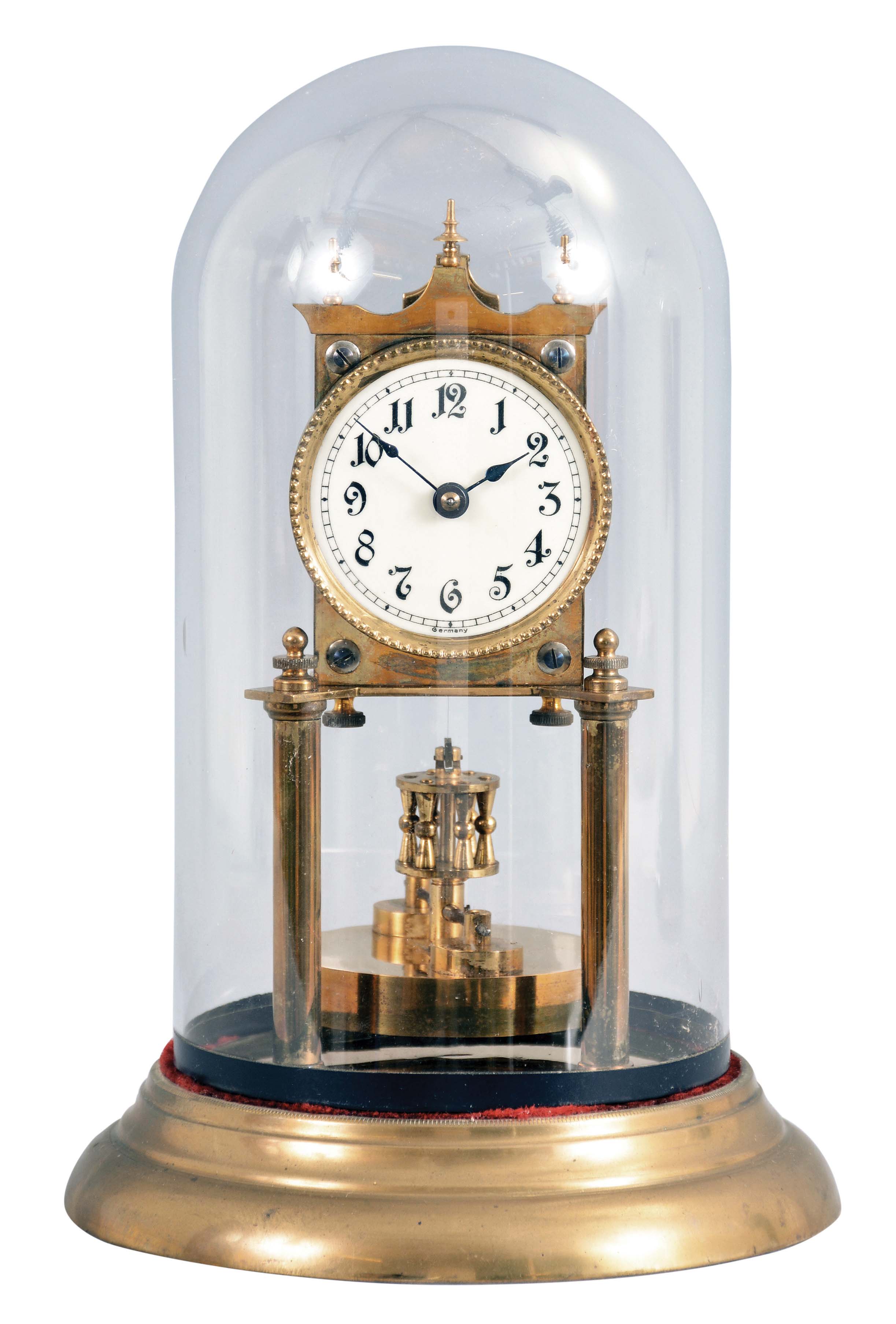 Germany, 400 day or anniversary clock, spring driven, torsion pendulum movement with disc pendulum in a polished brass case with cream porcelain dial under glass dome. — Antique Clocks Price Guide