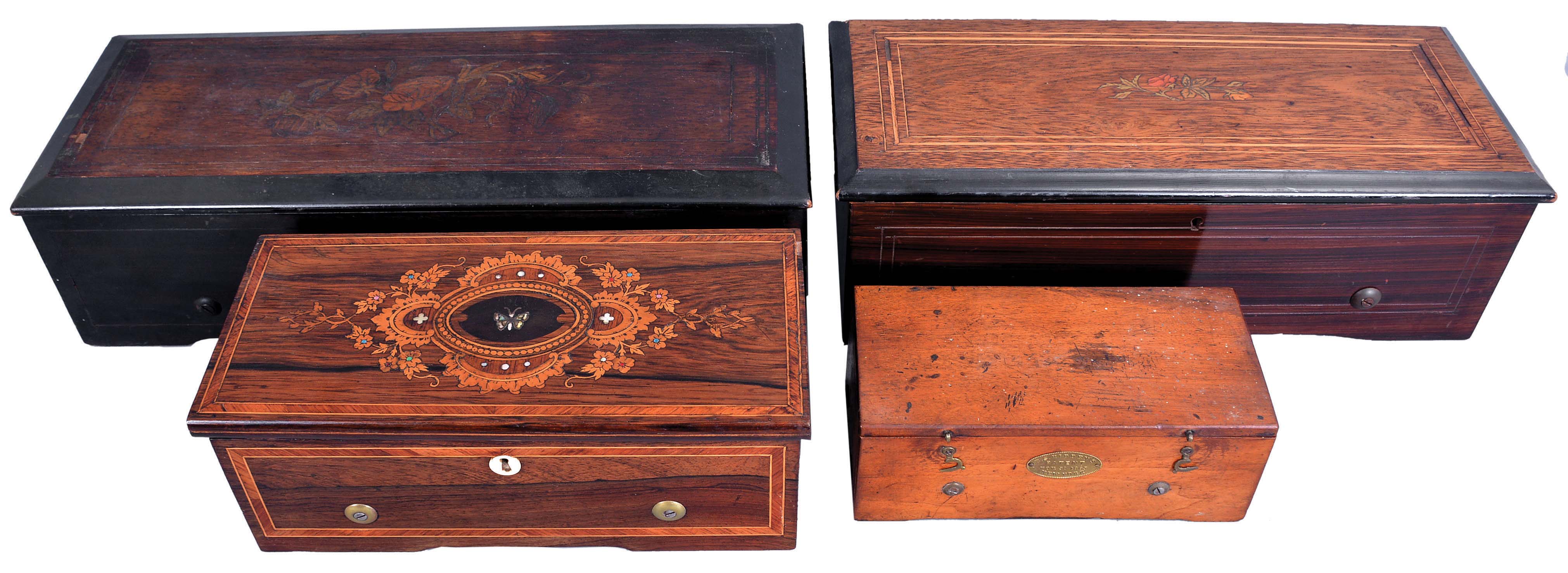 Music Boxes- 4 (Four) Swiss Music Boxes: (1) Switzerland, 6 tunes with a 12 inch cylinder playing on two combs of 40 and 74 teeth in an inlayed rosewood veneered case; (2) Switzerland, 8 tunes with a 6 inch cylinder playing on a 42 tooth comb in an inlayed rosewood and grain painted case; (3) B.A. Bremond, Geneva, Switzerland, 4 tunes with a 6 inch cylinder playing on a single comb of 74 teeth in an inlayed rosewood veneered case with mother of pearl; (4) E.S. Hiddens, New York with a 5 inch cylinder playing on a comb of 86 teeth in a mahogany case. — Antique Clocks Price Guide