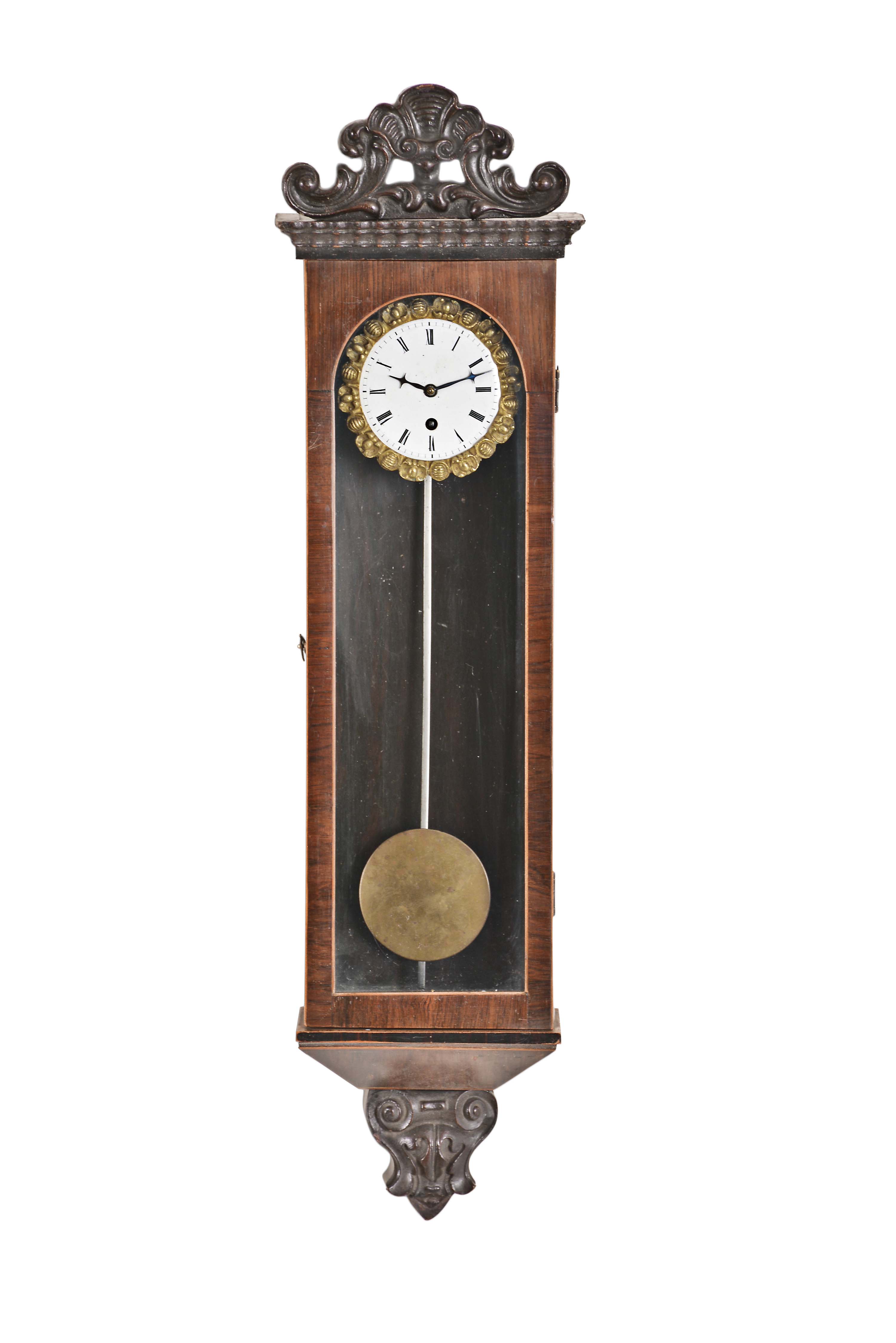 Austria, a miniature, Biedermeier style hanging timepiece, rosewood veneered three light case with contrasting stringing, the base with carved drop, and top with ripple molded cornice and carved, foliate crest, Roman numeral white enamel dial with gilt, ornamental bezel and blued steel hands, 30 hour, spring driven timepiece movement with recoil escapement and silk thread suspension, brass pendulum with steel rod, case back with faint stamp, possibly that of the of manufacturer — Antique Clocks Price Guide