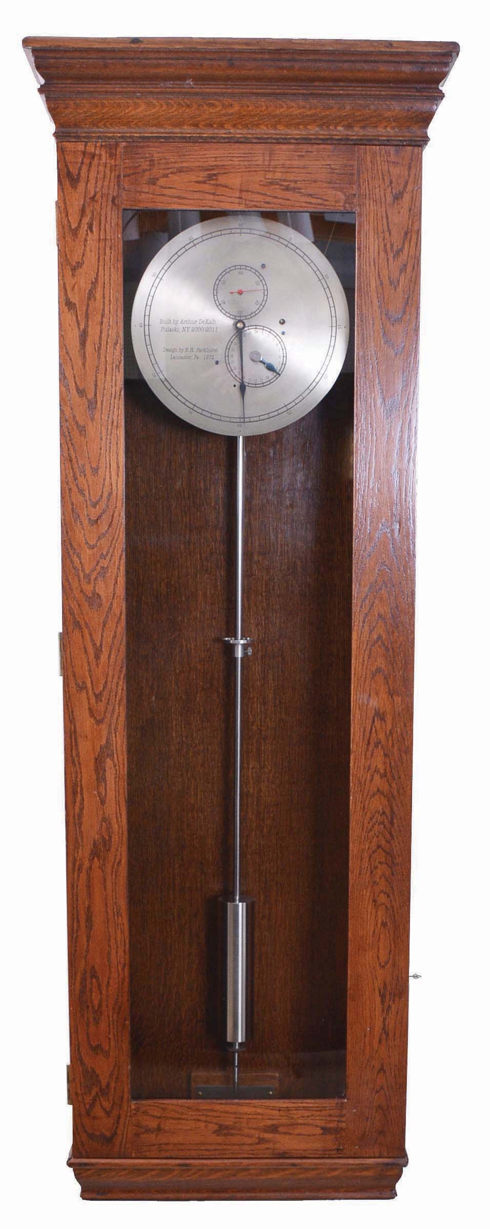 Jeweler's hanging regulator 8 day, time only, weight driven movement in period early 20th century oak case with movement built by Arthur Dekalb of Pulaski, NY and designed by the late E.H. Parkhurst, Lancaster, PA (Past President of NAWCC) in 1972 — Antique Clocks Price Guide