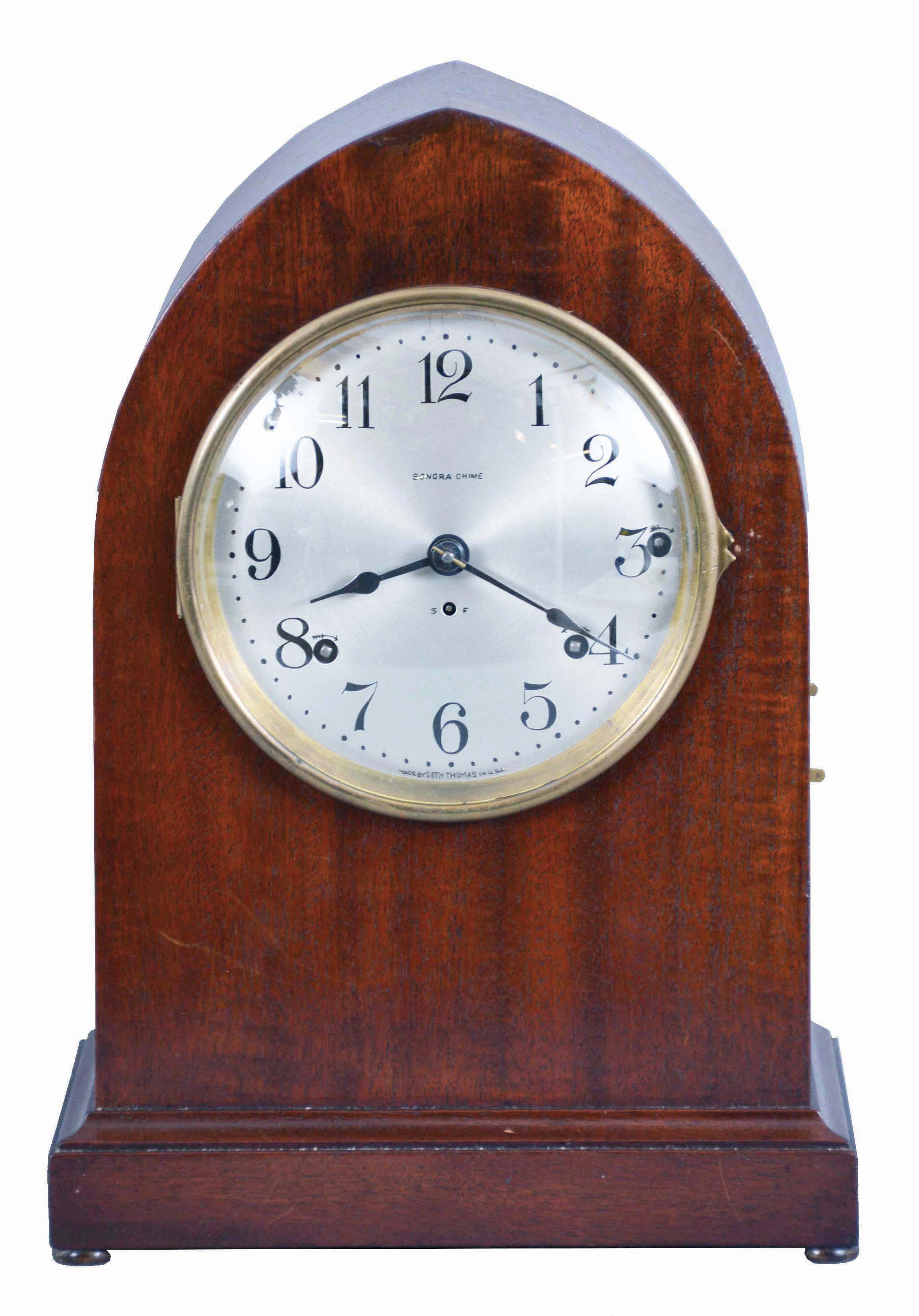 Seth Thomas Clock Co., Thomaston, Conn., "Chime Clock No. 214" shelf clock with a spring driven, 8 day time and 8 Bell Sonora strike movement in a mahogany case. This clock will play Whittington or Westminster chimes. — Antique Clocks Price Guide