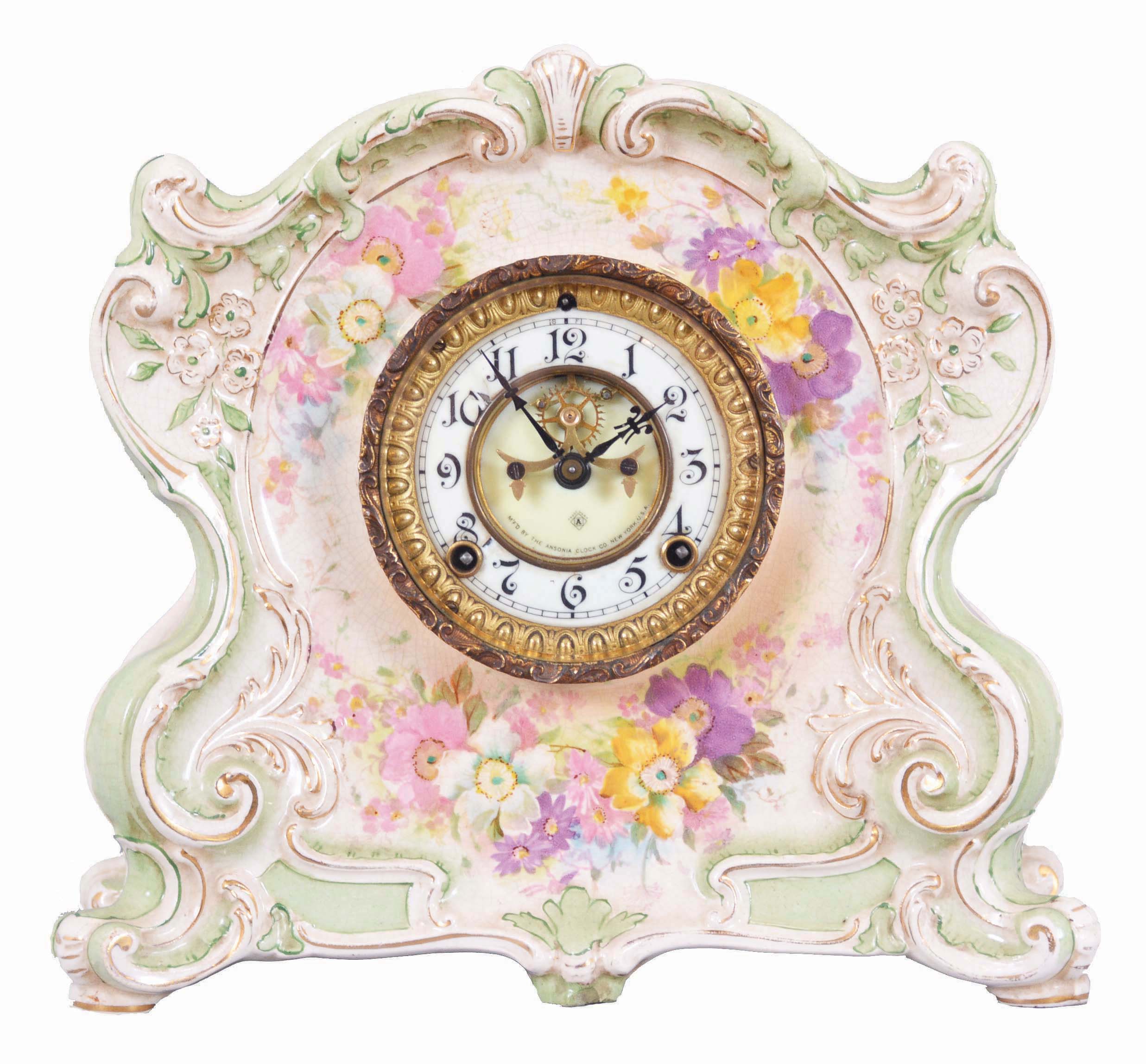 Ansonia Clock Co., New York, "La Cantal" mantel clock, 8 day, time and strike, spring driven movement with visible Brocot escapement in a green porcelain case with white porcelain dial with Roman numerals. — Antique Clocks Price Guide