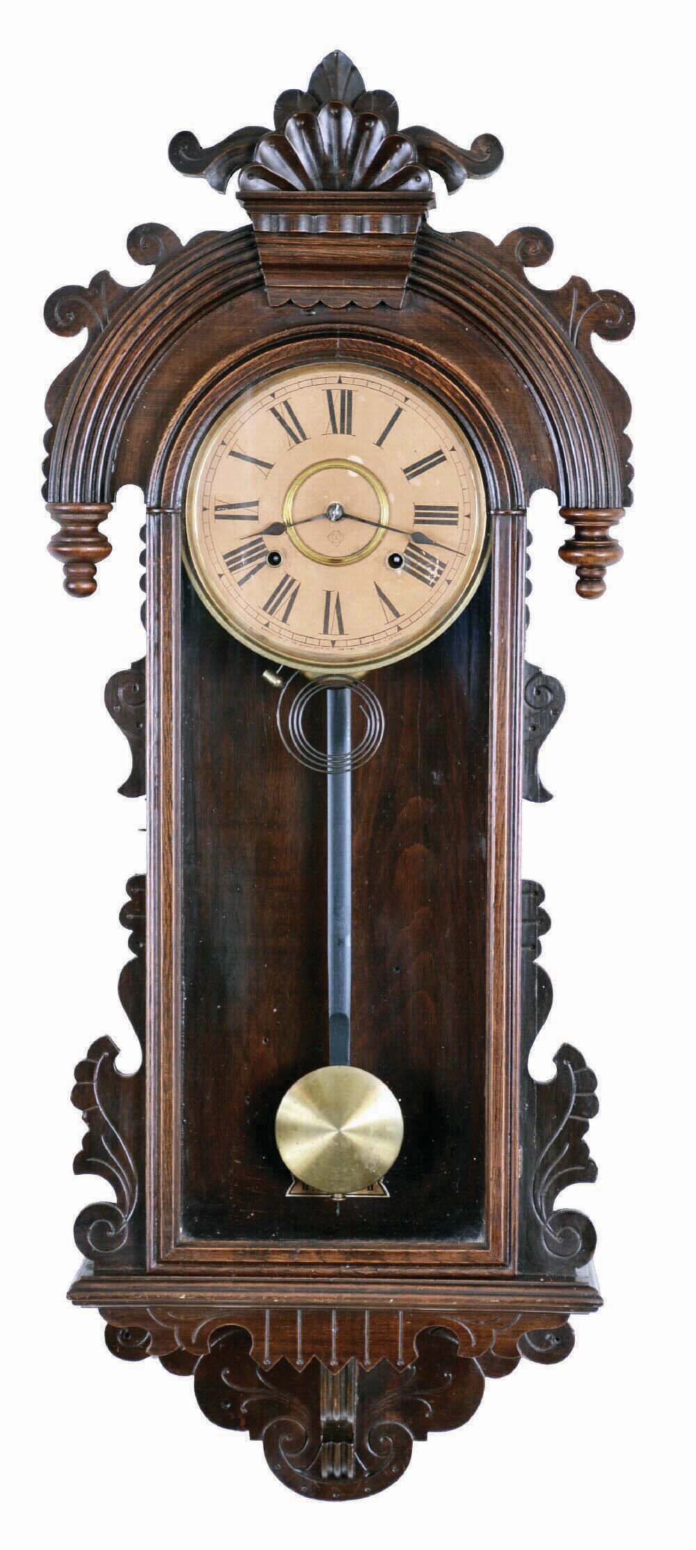 Ansonia Clock Co., New York, "Queen Isabella", 8 day, time and strike in a pressed and carved oak wall case. — Antique Clocks Price Guide