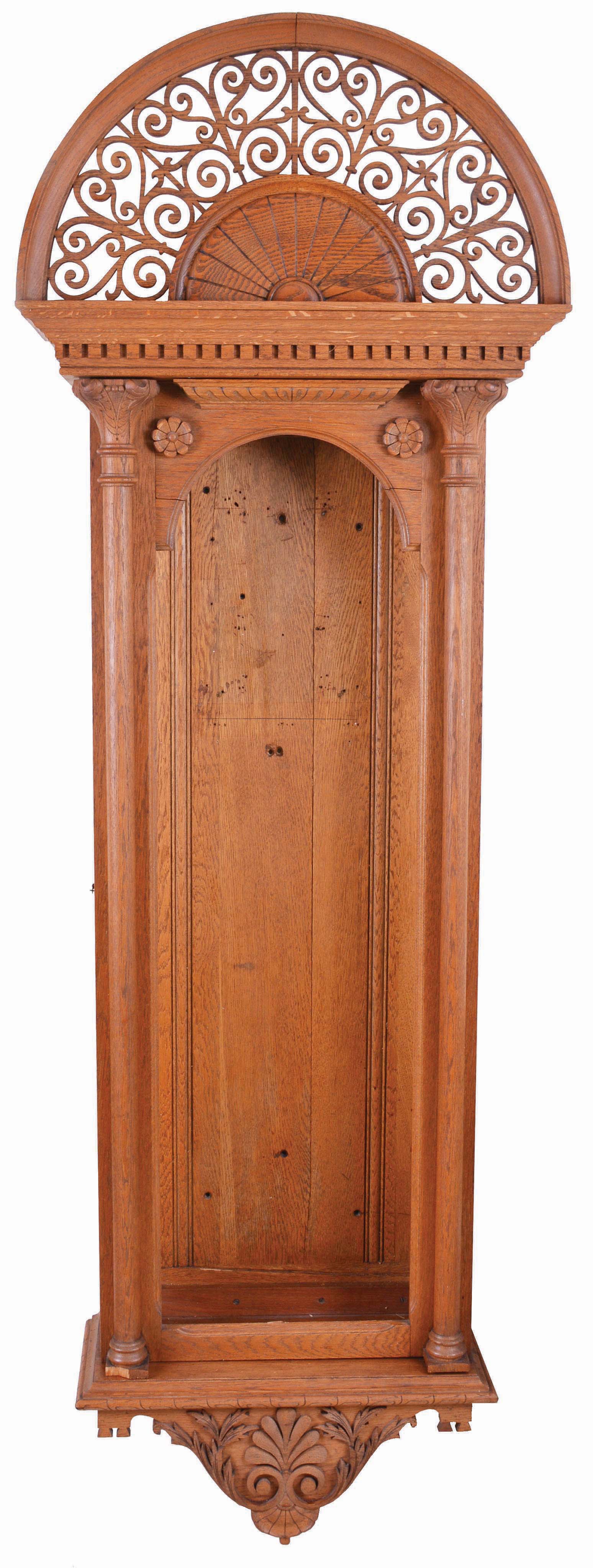 Jeweler's Regulator Case Only- 2 (Two): hanging in oak with fretwork top above sunburst carving and dental molding, full columns on door and carved trim on base, circa 1890; (2) standing in mahogany signed and dated inside of base, dated 1940 — Antique Clocks Price Guide