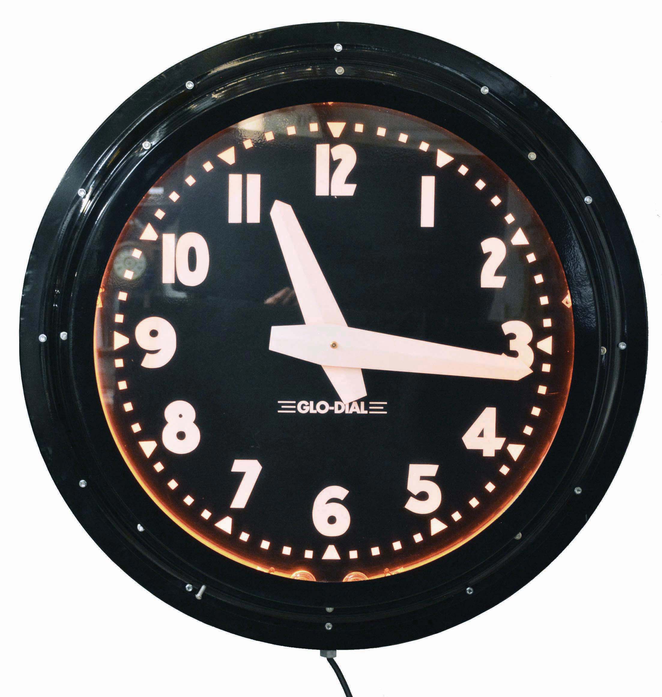 Glo-Dial Clock Company, Los Angeles, California, neon gallery wall clock, electric driven, time only movement with large 25.5in black dial, bold straight white hands, Arabic numerals and orange lighted neon perimeter — Antique Clocks Price Guide