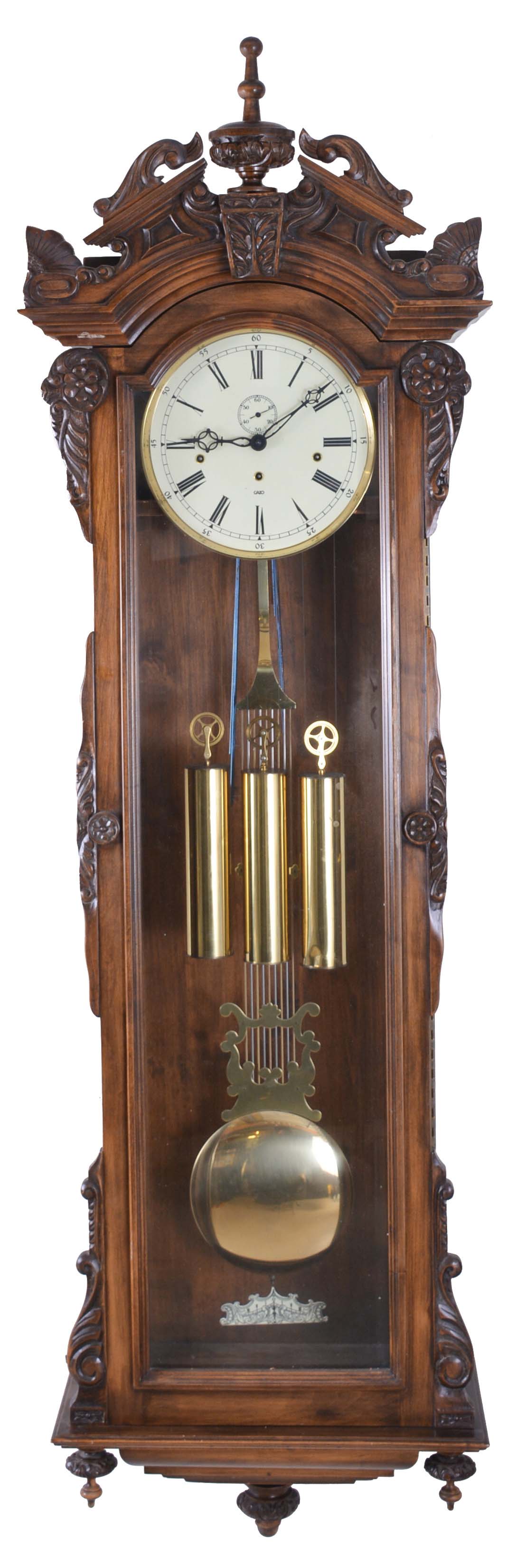 Gazo Family Clock Factory, San Diego, California, "XG-C" hanging jeweler's regulator, reproduction of Howard's "No. 60 Regulator", 8 day, time, strike and chime, three brass weight driven movement in a beveled glass front carved alderwood case with a cream enamel dial — Antique Clocks Price Guide