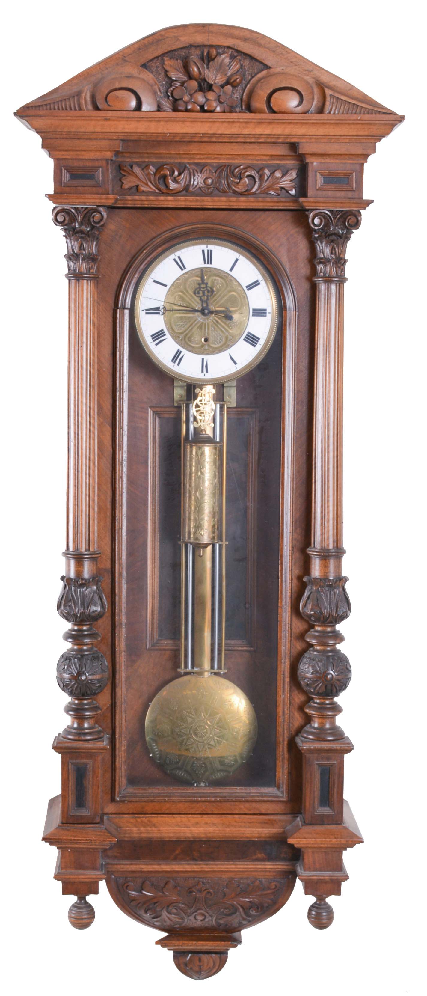 Austria or Germany, Vienna regulator wall clock, 8 day, time only, one brass weight driven clock in a walnut Altdeutsch style carved case with full columns on door, white enamel dial with engraved brass dial center and matching engraved weight and sweep seconds — Antique Clocks Price Guide