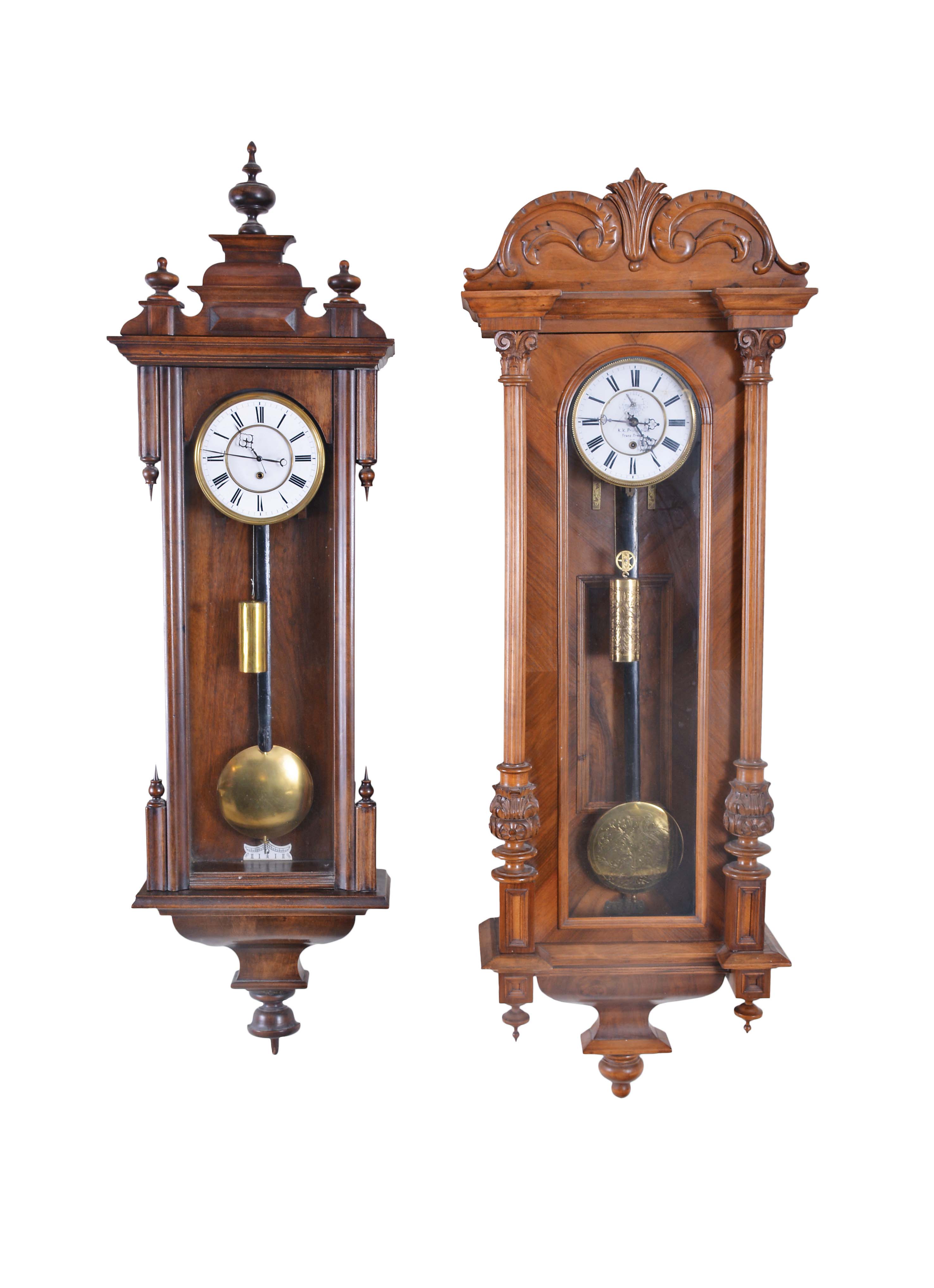 Clocks- 2 (Two) Vienna Regulator, 8 day, weight driven, time only movements: (1) K-K Privilegium, Franz Drexler, mahogany with matching embossed weight and pendulum bob; (2) Unsigned, walnut case — Antique Clocks Price Guide
