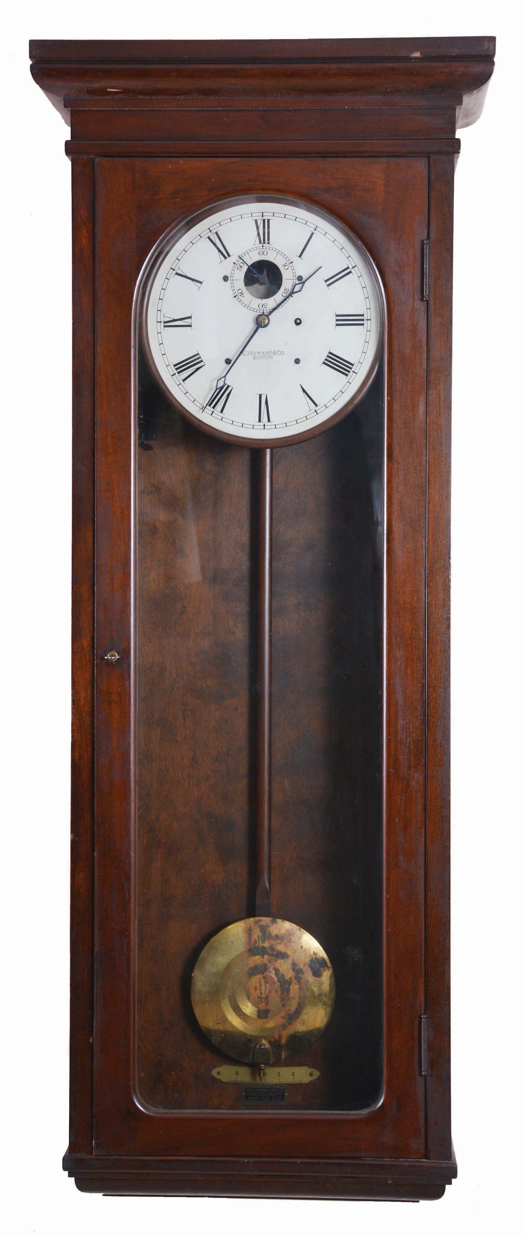 E. Howard &amp; Co., Boston, Mass., "Regulator No. 89", jeweler's regulator wall clock, 8 day, time only, weight driven movement with Graham deadbeat escapement sending electrical impulse to slaves in a mahogany case with a 12in painted metal dial — Antique Clocks Price Guide