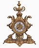 France, figural brass mantel clock, 8 day, time and strike on a pierced base with two short pillars supporting winged griffon figures in profile flanking a central cylinder holding an ornate brass dial with blued steel hands and white enameled cartouche numerals in blue, surmounted by a decorative urn. The pendule de Paris movement with partially exposed pendulum is stamped "CHLES MT".