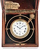 Elgin Watch Co., Elgin, Illinois, a feesprung Father Time deck watch with wind indicator, 18 size, 21 jewels, stem wind and lever set, adjusted, damascened, nickel plate movement with lever escapement, cut bimetallic balance, gold jewel settings and gold timing screws, with gimballed brass bowl, and contained in mahogany inner box, with outer cherry box, serial #21549335