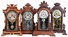 Clocks- 4 (Four): (1) E. Ingraham & Co., Bristol, Conn., "Faultless" shelf clock with a spring driven, 8 day, time and strike movement in a light wood case with black ornaments, c1884; (2) New Haven Clock Co., New Haven, Conn., "Euphrates" shelf clock with a spring driven, 8 day time, strike and alarm movement in a black walnut case, c1885. (3) E. Ingraham Clock Co., unidentified shelf clock with a spring driven, 8 day, time and strike movement in a walnut case, c1885. (4) Gilbert Clock Co., Winsted, Conn., "Nereid" shelf clock with a spring driven, 8 day, time and strike movement in a walnut case, c1881.