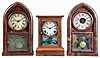 Clocks- 3 (Three): (1) Atkins Clock Co., Bristol, Conn., "Cottage XX" shelf clock with a spring driven, 8 day, time and strike movement in a rosewood veneered case, c1860; (2) Brewster & Ingrahams, Bristol, Conn., "Round Gothic" or "Beehive" shelf clock with a spring (brass) driven, 8 day, time and strike movement in a mahogany veneered case, c1848. (3) William L. Gilbert, Winchester, Conn., "Beehive" shelf clock with a spring driven, 8 day time, strike and alarm movement in a rosewood veneered case, c1850.