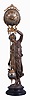 Ansonia Clock Co., New York, "Huntress" figural swinger, 8 day, time only, spring driven movement mounted inside a brass sphere with cast ribbon ornament and applied Arabic numerals, Louis XV style hands, the lower section in gridiron style with smaller sphere at the bottom, all supported by patinated spelter figure of a young woman carrying game birds standing atop an ebonized cast iron base, c1900.
