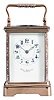 France, for Frank Herschede, Cincinnati, an 8 day, two train carriage clock with champleve enamel ormnament, polished brass Corniche case with enamel accented corners and handle, Arabic numeral white enamel dial with floral featoons, blued steel Breguet style hands, 8 day, time and strike movement with lever platform, counting the hours on a gong