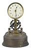 Germany, Eureka style, battery powered, electro-magnetic timepiece mounted on brass base with a large exposed rotating balance.