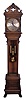 Seth Thomas Clock Co., Thomaston, Conn., "Regulator No. 21" later known as "Hall Clock No. 21" tall clock, 8 day, time, hour and Westminster chimes on a nest of 4 bells, weight driven movement with dead beat escapement in an oak case with beveled glass trunk door and carvings, paw feet and silvered brass dial