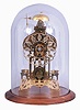 England, signed Smith, Clerkenwell, c1890 chain fusee pub movement, now in a modern skeletonized frame representing Brighton Pavilion, the frame appearing to have been cut on an EDM wire machine, and then polished by hand. The silvered dial is nicely fretted and the Roman Numerals are sharply engraved and black filled. The frame surmounted by a bell that is struck once on the passing of each hour. Covered by a round glass dome and mounted on a turned walnut base.