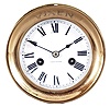 Waterbury Clock Co., Waterbury, Conn., "Ship's Bell No. 2", 8 day, time and strike, spring driven, jeweled movement in a polished brass case with hinged bezel and 4.5 inch porcelain dial, c1920.