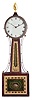 Attributed to Aaron Willard, Jr., Roxbury, Massachusetts, mahogany patent timepiece or "banjo" clock, iron roman numeral dial, brass bezel, side ornaments flanking the waist section, waist and box with cross banded frames for the reverse-painted glasses, the waist with gold floral and leafage decoration framing a central classical urn with climbing vine, the lower glass marked "Patent" within a centered rectangular panel with central aperture for pendulum viewing and leafage tied with a ribbon against a green ground, eight day timepiece movement with t bridge suspension, step train, and through bolts for case attachment, all powered by a period lead weight, regulated by a pendulum with steel rod and brass-faced bob, and period winding key. Provenance: J.T. Vogdes, Philadelphia as indicated by a printed label on the backboard of the case.