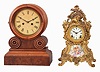 Clocks- 2 (Two): (1) Ansonia Clock Co., New York, "Trianon" shelf clock with a spring driven, 8 day, time and strike movement in a gilt cast metal case, c1914; (2) Ingraham Clock Co., Bristol, Conn., "Grecian" shelf clock with a spring driven 30 hour time and strike movement in a walnut case, c1875.