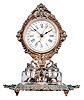 Ansonia Clock Co., New York, "Parlor Ink No. 3" inkstand clock, 30 hour, time and simple calendar, spring driven movement in a nickeled case with paper dial, cast brass base holding two glass inkwells with matching brass caps.