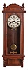 Waterbury Clock Co., Waterbury, Conn., "Regulator No. 3", two-weight, wall hanging timepiece, in a walnut case.
