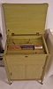 Music Box- Switzerland, "STELLA", 17 1/4 inch disc playing console music box,3 feet high, the cabinet painted appliance green in 1950, and with 40 discs, cabinet door opens and provides storage area for many discs.