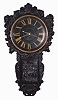 J. Thwaites, London, a large and impressive Act of Parliament or tavern clock, oak and mahogany case with carved dial surround featuring various flora and fauna, flanking cupids, and surmounted with acanthus and scallop shell ornament, the door with carved genre scene, sides with half caryatids, and base with acanthus surrounding a laurel wreath, dial with gilt Roman numerals and pierced brass hands, large, 8 day, 5 pillar timepiece movement with tapered plates, the front plate marked "I. Thwaites" and "1380", brass clad pendulum with wire rod and cylindrical lead weight