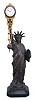 Germany, early 20th century, Junghans swinging arm timepiece, suspended from a spelter figure in the form of the Statue of Liberty.