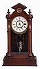 F. Kroeber Clock Co., New York, "Angel Swing No. 1" shelf clock with a spring driven, 8 day timepiece movement in a walnut case.