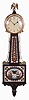 E. Howard & Co., Boston, Mass, "No. 95 Banjo Clock", in mahogany case with eagle finial surmounting the Arabic numeral dial marked "E. Howard & Co./Boston", brass bezel, flat frames for the reverse-paintings on glass, the lower depicting and marked "Constitution--Guerriere" in a blazing War of 1812 battle, a gilt patriotic eagle and banner tops the pendulum viewing port, all enclosed in a red, black and gilt oval cartouche with leafage surround and spandrels, the waist flanked with unusual brass side ornaments features repeating elements and colors set in an oblong border, the base carries a carved pedestal with acorn drop, eight day nickel plate movement marked "E. Howard & Co./Boston" with recoil escapement and viewing ports, maintaining power, and Geneva stop all powered by a lead weight and regulated by a brass faced pendulum bob with flat wooden rod and tie-down.
