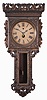 Votti and Newman, Philadelphia, rare wall clock with metallic painted finish over extensive gesso trim, and with rare front to back pendulum, and the patent date visible through the dial opening Jan 11, 1884. Note winding below 12. We could not calculate the running duration, although Votti made movements of week, month and year duration. We ESTIMATE that this is a one month clock.