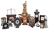 Clocks- 13 (Thirteen): (1) Horolovar repro of Flying Pendulum clock; (2) Oil lamp clock with shade (Pride of America); (3) c1904-Plato digital leaf clock; (4) Miniature New Haven OG (6in); (5) tiny 2 in movement German wall clock, weight driven; (6) New Haven lighthouse clock LESS top, duplex movement intact, (7) Mini YALE pendulette steeple clock; (8) Paper Weight ball clock, sig Brown & Willis, Fitchburg. (9) A. E. Hotchkiss nickel plated pendulette (10) Waterbury brass cased mini alarm; (11) German chain drive souvenir clock; (12) 1916 Nojar stem wind watch-clock in hard rubber case; (13) Door stop clock, Lady with broken arm.